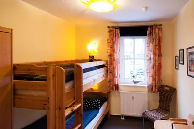 Ein Bett oder Betten in einem Zimmer der Unterkunft Fritz-Reuter-Straße 4 Whg 2 - a57823