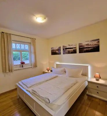 Ein Bett oder Betten in einem Zimmer der Unterkunft Haus 