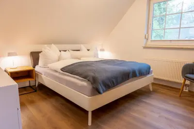 Ein Bett oder Betten in einem Zimmer der Unterkunft Ostseedomizil 