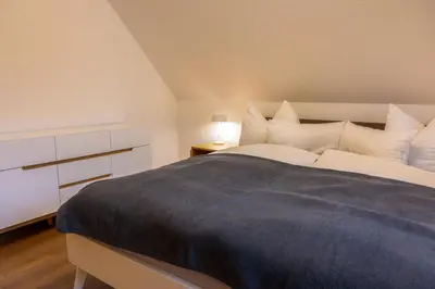 Ein Bett oder Betten in einem Zimmer der Unterkunft Ostseedomizil 