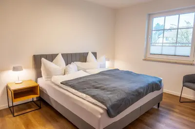 Ein Bett oder Betten in einem Zimmer der Unterkunft Ostseedomizil 