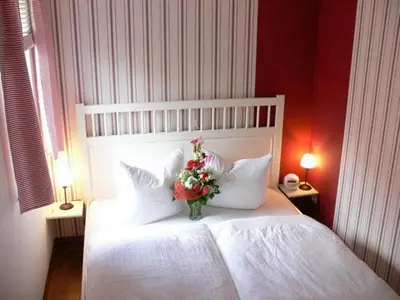 Ein Bett oder Betten in einem Zimmer der Unterkunft Anlage Dünengarten Ferienhaus Seebrise
