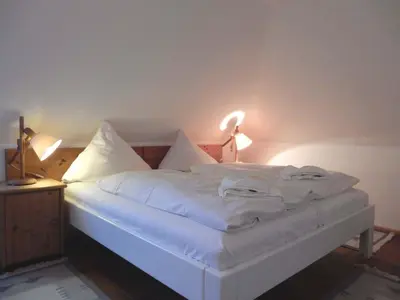 Ein Bett oder Betten in einem Zimmer der Unterkunft Resi E06