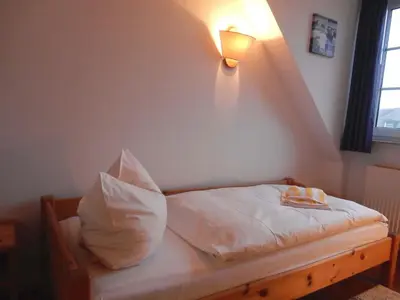 Ein Bett oder Betten in einem Zimmer der Unterkunft Resi E06