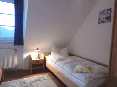 Ein Bett oder Betten in einem Zimmer der Unterkunft Resi E06