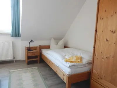 Ein Bett oder Betten in einem Zimmer der Unterkunft Resi K6