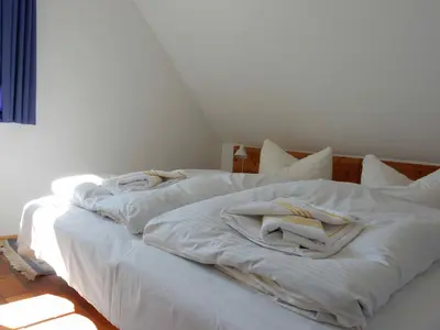 Ein Bett oder Betten in einem Zimmer der Unterkunft Gästehaus 7