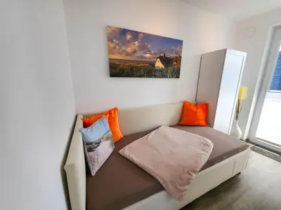 Ein Bett oder Betten in einem Zimmer der Unterkunft Möövkieker - Whg 3