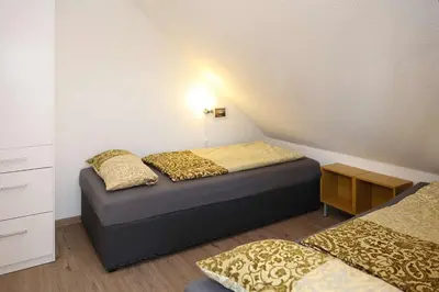 Ein Bett oder Betten in einem Zimmer der Unterkunft Haus Eichenkrone