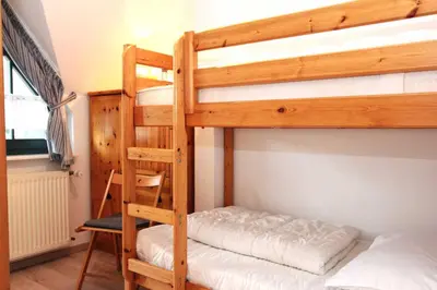 Ein Bett oder Betten in einem Zimmer der Unterkunft Schwalbennest