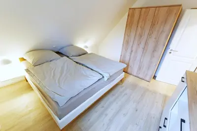 Ein Bett oder Betten in einem Zimmer der Unterkunft Buchenpark - Darß Glück