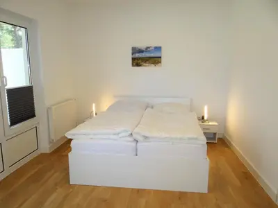 Ein Bett oder Betten in einem Zimmer der Unterkunft Ferienanlage Haus hinter den Dünen App 6 EG 1