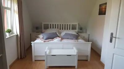 Ein Bett oder Betten in einem Zimmer der Unterkunft Haus Sonnenwind