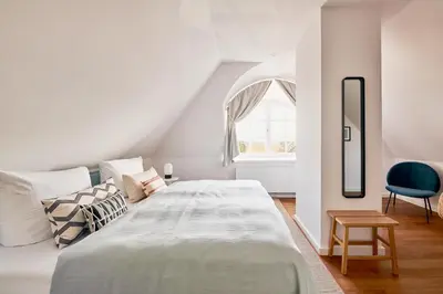 Ein Bett oder Betten in einem Zimmer der Unterkunft GRONERS Ahrenshoop