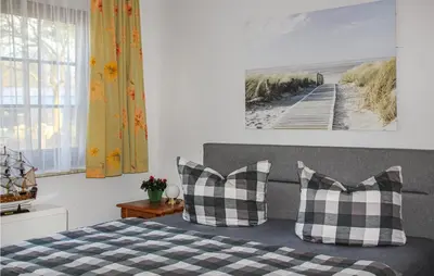 Ein Bett oder Betten in einem Zimmer der Unterkunft Ferienhaus Hafenstr. 6 / FH M