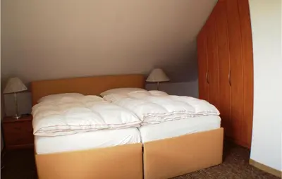 Ein Bett oder Betten in einem Zimmer der Unterkunft Awesome Home In Fuhlendorf With Kitchen