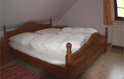 Ein Bett oder Betten in einem Zimmer der Unterkunft Awesome Home In Fuhlendorf With Kitchen
