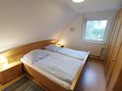 Ein Bett oder Betten in einem Zimmer der Unterkunft Karimea