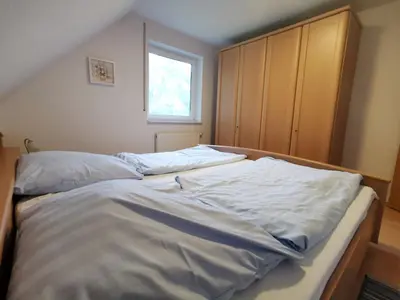 Ein Bett oder Betten in einem Zimmer der Unterkunft Karimea