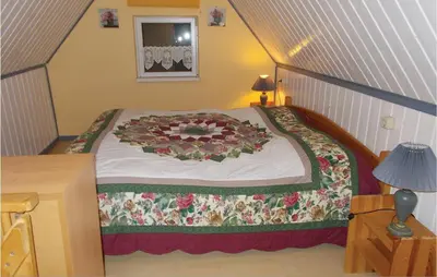 Ein Bett oder Betten in einem Zimmer der Unterkunft Ferienhaus Waldreihe Q