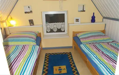 Ein Bett oder Betten in einem Zimmer der Unterkunft Ferienhaus Waldreihe Q