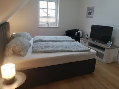 Ein Bett oder Betten in einem Zimmer der Unterkunft FH Rosengang - fuer 6 Personen, Kamin, Terrasse, Garten