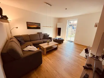 Ein Sitzbereich in der Unterkunft FH Rosengang - fuer 6 Personen, Kamin, Terrasse, Garten
