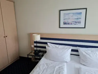 Ein Bett oder Betten in einem Zimmer der Unterkunft Am Kurhaus 212