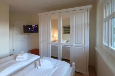 Ein Bett oder Betten in einem Zimmer der Unterkunft Sanddornperle