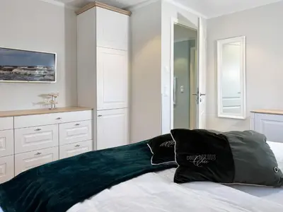 Ein Bett oder Betten in einem Zimmer der Unterkunft Hus oevern diek