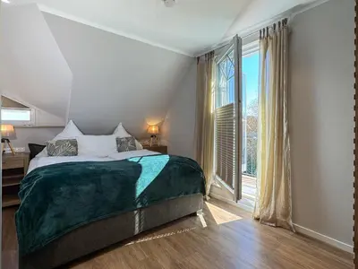 Ein Bett oder Betten in einem Zimmer der Unterkunft Hus oevern diek