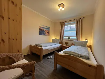 Ein Bett oder Betten in einem Zimmer der Unterkunft Ferienwohnung Baumann Haus Meer
