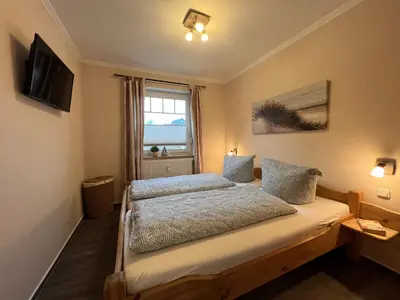Ein Bett oder Betten in einem Zimmer der Unterkunft Ferienwohnung Baumann Haus Meer