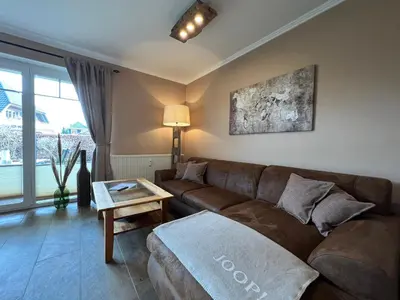 Ein Sitzbereich in der Unterkunft Ferienwohnung Baumann Haus Meer