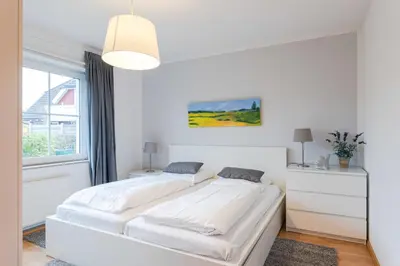 Ein Bett oder Betten in einem Zimmer der Unterkunft Ostseewelle Whg 1