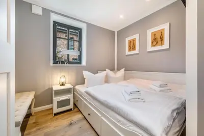 Ein Bett oder Betten in einem Zimmer der Unterkunft Achterliek