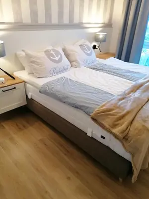 Ein Bett oder Betten in einem Zimmer der Unterkunft Apartment 509 - FeWo in der Villa Kurpark