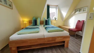 Ein Bett oder Betten in einem Zimmer der Unterkunft Am Deich 30 Strandadler Zingst - a63779