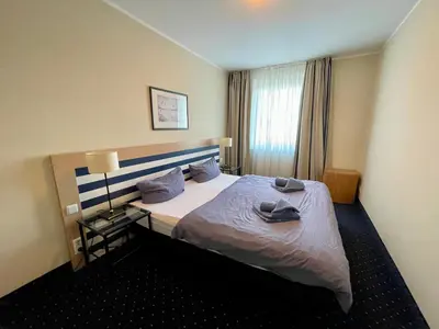 Ein Bett oder Betten in einem Zimmer der Unterkunft Küstenfeuer