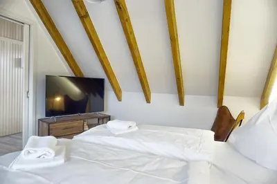 Ein Bett oder Betten in einem Zimmer der Unterkunft Haus Seevogel - Suite Kranich - a57544