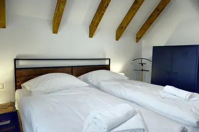 Ein Bett oder Betten in einem Zimmer der Unterkunft Haus Seevogel - Suite Kranich - a57544