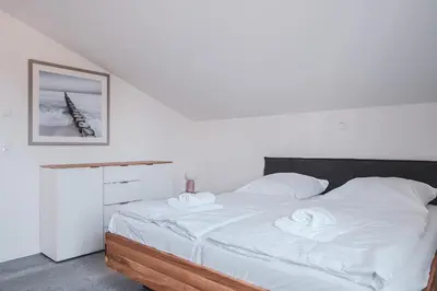 Ein Bett oder Betten in einem Zimmer der Unterkunft Ostseehaus Ostseehaus 5