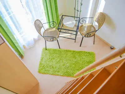 Ein Sitzbereich in der Unterkunft Ferienhaus Bodden