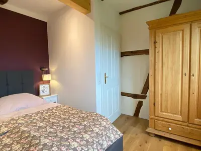 Ein Bett oder Betten in einem Zimmer der Unterkunft Gutshaus Kranichflug