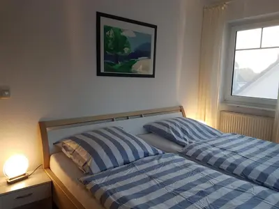 Ein Bett oder Betten in einem Zimmer der Unterkunft Darßer Weg 32a 