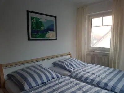 Ein Bett oder Betten in einem Zimmer der Unterkunft Darßer Weg 32a 