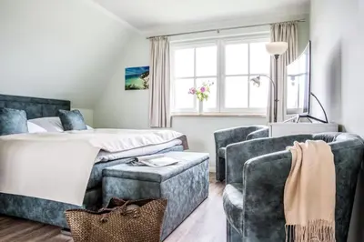Ein Sitzbereich in der Unterkunft Haus Rose, Luxus-Ferienhaus in Fuhlendorf fur 4 Personen