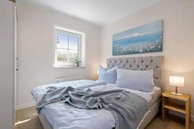 Ein Bett oder Betten in einem Zimmer der Unterkunft Zum Fährmann 2 Whg 2 rechts in 18356 Pruchten