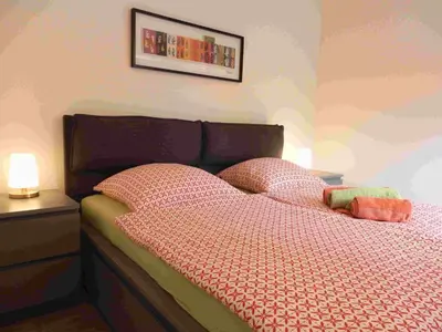 Ein Bett oder Betten in einem Zimmer der Unterkunft Haus am Nordstrand 2
