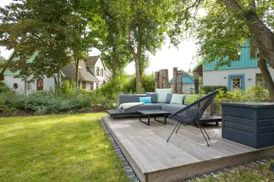 Ein Garten an der Unterkunft Ferienhaussiedlung Strandperlen Sanddornhof 1b Typ III